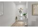 Bright foyer with tile floors, a decorative mirror, and an inviting entrance at 11473 Listening Dr, Orlando, FL 32832
