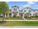 Charming two-story townhome with well-maintained landscaping and inviting front porch at 11473 Listening Dr, Orlando, FL 32832