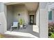 Covered front porch with decor, seating, and a welcoming entrance to the home at 11473 Listening Dr, Orlando, FL 32832