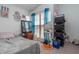 Bright bedroom featuring a large window with blue curtains and ample storage at 117 Coventry Ln, Haines City, FL 33844