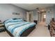 Spacious main bedroom featuring large bed, access to bathroom, and closet space for storage at 117 Coventry Ln, Haines City, FL 33844