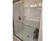 Shower stall with glass door, chrome showerhead, and modern fixtures at 1241 Denali Dr, Winter Haven, FL 33881