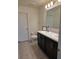 Well-lit bathroom with double vanity, sleek cabinets, and modern fixtures at 1241 Denali Dr, Winter Haven, FL 33881