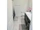 Modern bathroom with a sleek vanity, toilet, and stylish shower curtain, designed for comfort and convenience at 1241 Denali Dr, Winter Haven, FL 33881
