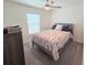 Comfortable bedroom featuring neutral decor, plush carpet, and a ceiling fan at 1241 Denali Dr, Winter Haven, FL 33881