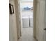 Convenient laundry room with a full-size washer and dryer, providing ease and efficiency for laundry tasks at 1241 Denali Dr, Winter Haven, FL 33881