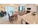 Open concept living and dining area with neutral decor and ample natural light at 1241 Denali Dr, Winter Haven, FL 33881