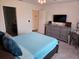 Comfortable main bedroom with plush bedding and an attached bathroom, offering privacy at 1241 Denali Dr, Winter Haven, FL 33881
