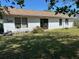 Spacious backyard with a simple patio, offering plenty of room for outdoor activities at 133 Bianca Ct, Kissimmee, FL 34758