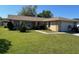 Charming single-story home with a well-maintained front lawn and stone accents at 133 Bianca Ct, Kissimmee, FL 34758