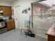 Another view of the functional kitchen with tile flooring and a bright window at 133 Bianca Ct, Kissimmee, FL 34758
