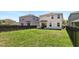 Spacious fenced backyard with lush green grass, great for outdoor entertaining at 1338 Riley Cir, Deland, FL 32724