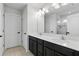 Bright bathroom with double sinks, modern vanities, and a large mirror at 1338 Riley Cir, Deland, FL 32724