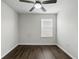 Empty bedroom featuring a ceiling fan, wood-look floors and natural light at 1338 Riley Cir, Deland, FL 32724