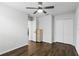 Bedroom featuring a ceiling fan, closet and wood-look floors at 1338 Riley Cir, Deland, FL 32724