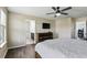Comfortable bedroom with an ensuite and decorative ceiling fan at 1338 Riley Cir, Deland, FL 32724