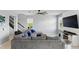 Spacious living area featuring tile floors, a large sectional sofa, and a staircase to the upper level at 1338 Riley Cir, Deland, FL 32724