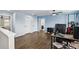 Bright loft area with wood floors, a ceiling fan, and a stylish desk setup at 1338 Riley Cir, Deland, FL 32724