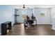 Spacious loft area featuring wood floors, natural light, and a comfortable workspace at 1338 Riley Cir, Deland, FL 32724