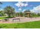 Fun-filled community playground with swings, climbing structures, and picnic tables for Gathering enjoyment at 1338 Riley Cir, Deland, FL 32724