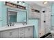 Bathroom featuring double sinks, tiled shower, and modern fixtures at 13959 Marine Dr, Orlando, FL 32832