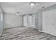 Open bedroom area with modern flooring, ceiling fans, and closet storage at 13959 Marine Dr, Orlando, FL 32832