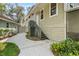 Exterior home view with patio area, stairs, and surrounding greenery at 13959 Marine Dr, Orlando, FL 32832
