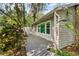 Home featuring lush landscaping, a well-maintained exterior, and a charming walkway at 13959 Marine Dr, Orlando, FL 32832