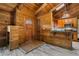 Rustic interior with wood-paneled walls, vaulted ceilings, and a cozy breakfast bar at 13959 Marine Dr, Orlando, FL 32832