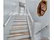 Bright staircase with a wooden-framed decorative mirror, railing, and light blue walls at 13959 Marine Dr, Orlando, FL 32832