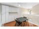 Bright bonus room featuring built-in storage cabinets and table at 1730 King Henry Dr, Kissimmee, FL 34744