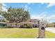 Charming two-story home with well-manicured lawn and mature trees at 1730 King Henry Dr, Kissimmee, FL 34744