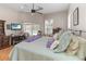 Bright main bedroom with ceiling fan, walk out access to pool and en suite at 1730 King Henry Dr, Kissimmee, FL 34744