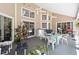 Covered patio with dining area, ceiling fans, and access to the pool at 1730 King Henry Dr, Kissimmee, FL 34744