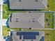 Birds-eye view of the roof with solar panels and a fenced backyard at 1774 Walnut Creek Dr, Kissimmee, FL 34744