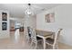 Dining area with chandelier lighting and table with seating, adjacent to living space at 1774 Walnut Creek Dr, Kissimmee, FL 34744