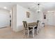 Bright dining room featuring tile floors, stylish lighting, and seating for six at 1774 Walnut Creek Dr, Kissimmee, FL 34744