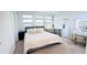 Bright bedroom with a cozy bed, a desk, and a vanity, creating a comfortable space at 1868 Sanibel Dr, Davenport, FL 33896