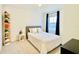 Charming bedroom featuring a comfortable bed, and a display shelf perfect for relaxation at 1868 Sanibel Dr, Davenport, FL 33896