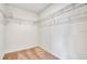Walk-in closet with ample shelving and carpeted flooring, perfect for storage at 1868 Sanibel Dr, Davenport, FL 33896