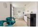 Inviting dining area with a round table, chairs, and a kitchenette with stainless steel refrigerator at 1868 Sanibel Dr, Davenport, FL 33896