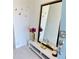 A stylish entryway with a large mirror, accent decor, and a modern aesthetic at 1868 Sanibel Dr, Davenport, FL 33896