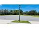 Street view showing a streetlamp and surrounding landscape at 1868 Sanibel Dr, Davenport, FL 33896