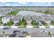 Community aerial view showcasing homes surrounding a serene lake at 1872 Summer Serenity Dr, Kissimmee, FL 34744