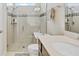 Modern bathroom featuring a glass-enclosed shower and a neutral color scheme at 1872 Summer Serenity Dr, Kissimmee, FL 34744