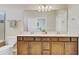 Bathroom featuring a double vanity with framed mirror and a shower/tub combo at 1872 Summer Serenity Dr, Kissimmee, FL 34744