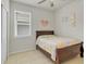 Bedroom with a ceiling fan and a window letting in natural light at 1872 Summer Serenity Dr, Kissimmee, FL 34744