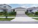 Charming single-Gathering home featuring a two-car garage and well-maintained landscaping at 1872 Summer Serenity Dr, Kissimmee, FL 34744