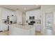 Bright kitchen with white cabinetry, stainless steel appliances, and a quartz countertop island at 1872 Summer Serenity Dr, Kissimmee, FL 34744