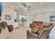 Spacious open-concept living area with tile flooring, ceiling fan, white walls and recessed lighting at 1872 Summer Serenity Dr, Kissimmee, FL 34744